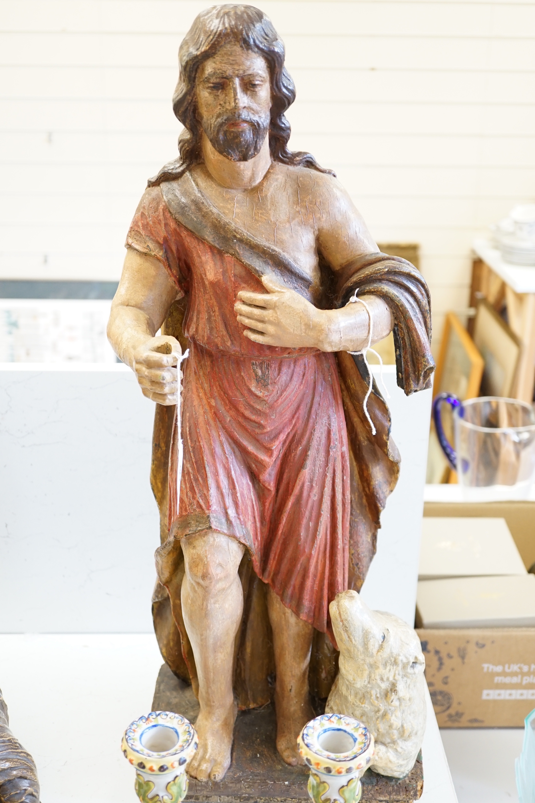 An antique carved and painted wood figure of Christ with a sheep, 69cm high